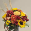 BEAUTIFUL FALL ARRANGEMENT IN BRONZE AND GOD TONES. SUNFLOWERS AND MUMS GIVE