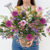 The Maeve is a serene and elegant floral arrangement, captivating with its