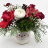 Send some holiday cheer with our Santa Baby flower arrangement. Seasonal premium