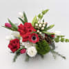 Celebrate the season with our Yuletide Cheer arrangement! Our Yuletide Cheer arrangement
