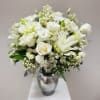 A timeless masterpiece of purity and grace. This elegant arrangement features premium