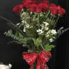 Two dozen red roses with greens, filler, &amp; a red bow
