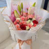 An exquisite mix of pink, red, and white roses paired with elegant