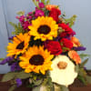 A bountiful pumpkin overflowing with premium fall flowers. A great addition to