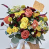 Crimson Harvest Bloom is an elegant fall pumpkin arrangement featuring vibrant shades