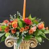 Tabletop Thanksgiving arrangement full of autumn blooms and a candle
