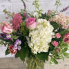 Swing into spring with sweet spring colors. A mix of hydrangeas, tulips