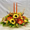 This elegant table centerpiece is created using seasonal garden flowers including sunflowers