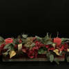 A Beautiful Faux Flower Centerpiece With LED Candles To Bring Holiday Cheer