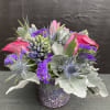 This glamorous mosaic glass vase shimmers beneath a beautiful bouquet of Pink