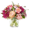 A charming harmony of soft peach roses, blush alstroemeria, and rich berry-hued