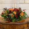 Seasonal Fall flowers in tray with gourds and candles.
Standard version is approximately