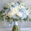 This bridal bouquet features blue and white hydrangea with a touch of