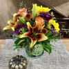 Recipe: Sunflowers, Roses, Lilies, Cushion mums, Daisies in a 6&rdquo; green vase.