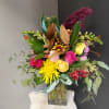 A beautifully selected bunch of the freshest flowers in a vase uniquely