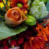 Ring in the season with this fresh, colorful arrangement of Fall flowers.
This
