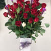 50 premium long red roses in a 24&quot; white modern vase