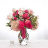 Pink mix of roses, hydrangea and baby&#039;s breath complete with a pink
