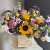 A beautifully selected bunch of the freshest flowers in a vase uniquely