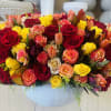 Golden Harvest Arrangement, a radiant blend of orange and yellow blooms that