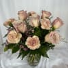 Roses and carnations in a vase with greens and filler!  Simple