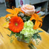 COMPACT MIXED FALL CENTERPIECE OF ORANGE, PEACH, AND LIGHT GREEN LILIES, GERBERA