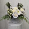 This frosted-inspired vase includes fragrant evergreens and all-white flowers to create a