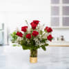 Express love and passion with our elegant red roses arrangement, featuring premium