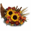 Along with joy, this cornucopia carries an abundance of beautiful fall flowers