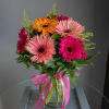A lovely, cheerful mix of a dozen gerbera daisies and greens in
