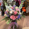 A ROMANTIC BOUQUET OF ROSES, DELPHINIUM AND STOCK WITH MIXED GREENS AND