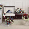 Celebrate a life of distinguished service with elegant, patriotic blooms. Carefully hand-made