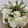 glass vase with a white hydrangea, white dahlia, garden roses and white