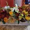 The beauty of late Fall is apparent in this stunning rustic centerpiece.