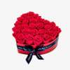 A romantic heart-shaped box filled with lush, velvety red roses. This timeless