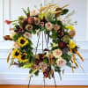 A wreath filled with autumn tones and natural dried elements, Harvest of