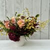 A stunning arrangement with the most beautiful hydrangeas, dahlias,orchids, fall berries, garden