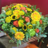 A fall arrangement is a warm, cozy floral display inspired by the