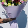 A purple flower arrangement is elegant and sophisticated, often symbolizing royalty, creativity
