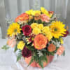 Mixed fall flowers in a keepsake glass pumpkin! Flowers and design will
