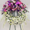A graceful double standing wreath expressing love and remembrance. Features premium roses