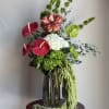 a premium floral arrangement, featuring seasonal specialty blooms thoughtfully style in a