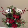 Our Christmas Bliss silk poinsettia arrangement brings joy and festive spirit into