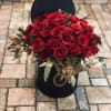 Classic red roses arranged in a classy gift box, adorned with tulle