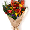 Sunset Sky Wrapped Bouquet includes a mix of bold and bright fresh-cut