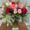 This classic vase arrangement includes Garden Roses, Queen Annes Lace, Tulips (when