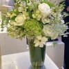 An elegant and classic arrangement of shades of white and green hydrangeas