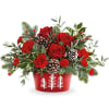 Teleflora&#039;s Winter Whimsy Centerpiece brings festive cheer to your table. Red roses