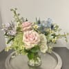 Petite garden style vase arrangement featuring premium mixed florals and greenery in