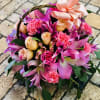 A fanciful basket full of lush blooms, Pink Floral Fantasy is a